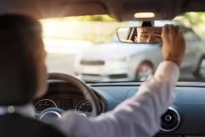 adjusting car rearview mirror