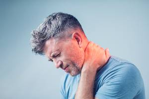 man with severe neck pain