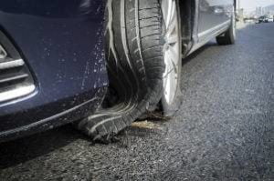 blown out tire on road during day