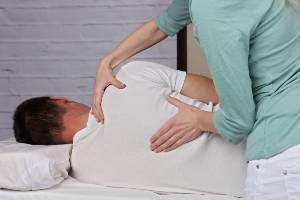 chiropractic adjustment of patient's back