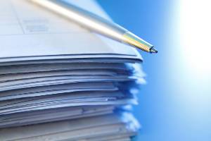 paperwork with pen on top