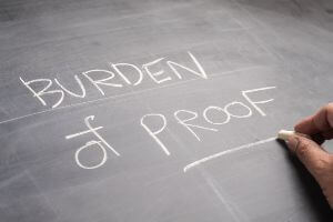 chalkboard with burden of proof written on it