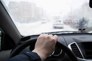 driver on road in the snow