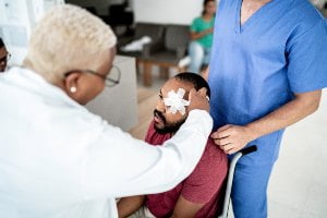 man with bandages over eyes