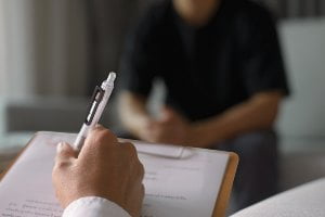 psychologist doing assessment of patient