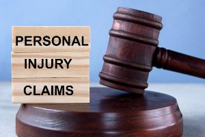 gavel next to wood blocks that say personal injury claims