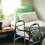 Current image: walking frame next to an empty bed