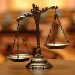 Current image: Scales of Justice on Table in Court Social