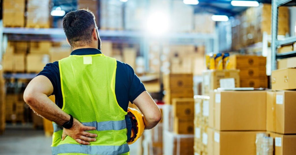 Current image: worker with orange vest with back pain
