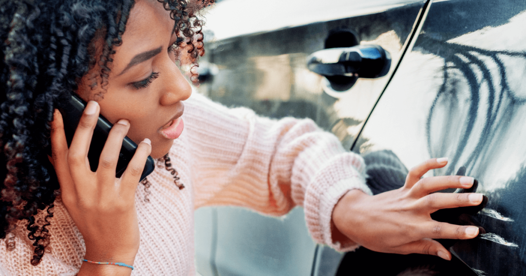 Current image: Woman Studying Vehicle Damage Social