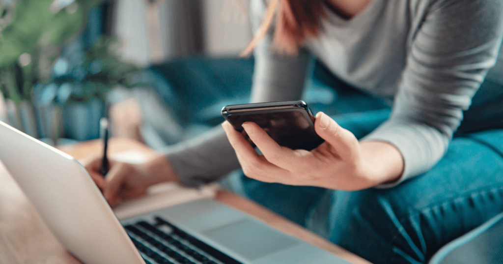 Current image: |woman using calculator by laptop