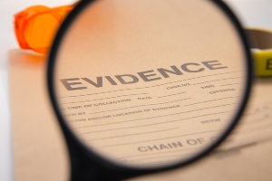 close up image of a magnifying glass over the word "evidence"