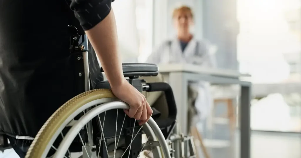 Current image: person in wheelchair visiting medical provider