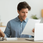 Current image: Confused Man Looking at Letter Social