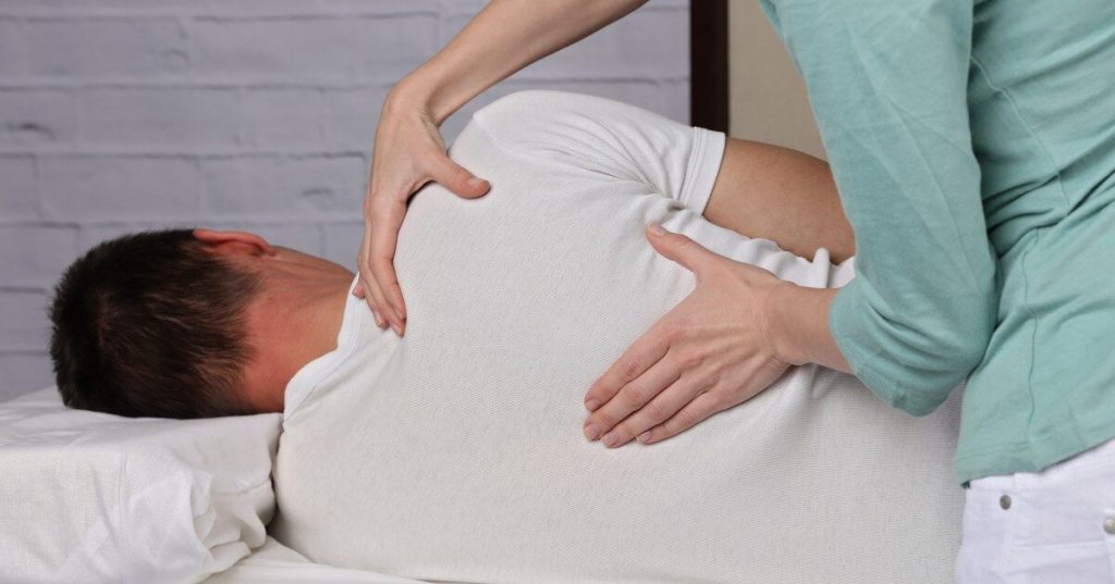 Current image: chiropractic adjustment of patient's back