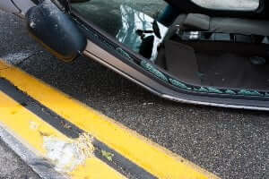 sedan rolled over on road