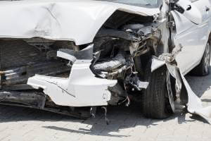 damage to front of white car