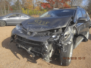 suv after wreck with smashed hood