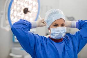 female doctor putting on mask