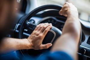 driver angrily honking car horn