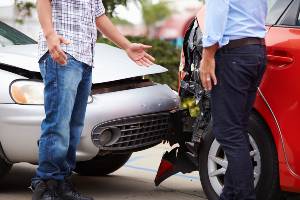 argument in front of damaged cars