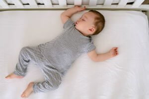 baby asleep on flat surface