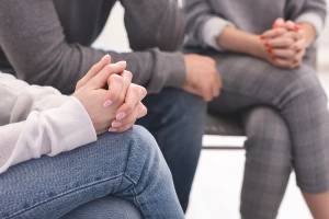 people sitting in circle at support group