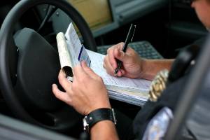 completing an accident report in police car