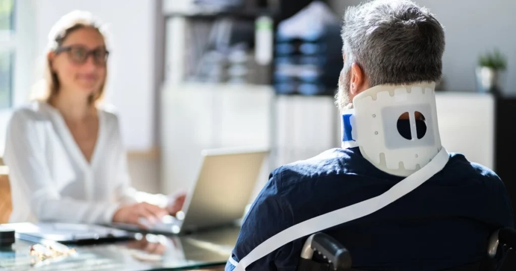 Current image: image of a female attorney facing a male in a wheelchair.