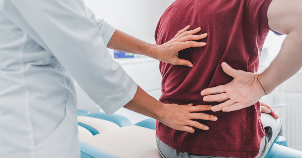 Current image: doctor with patient with back pain