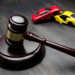 Current image: Gavel by Toy Cars on Table Social