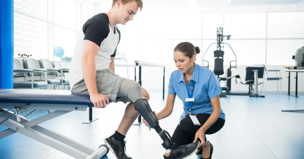 young man with prosthetic leg in physical therapy