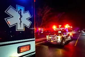 ambulance at crash scene at night
